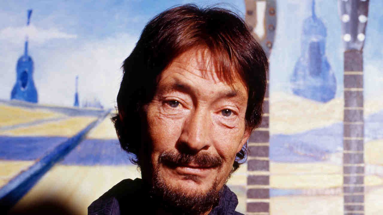 Chris Rea posing for a photograph in 2005
