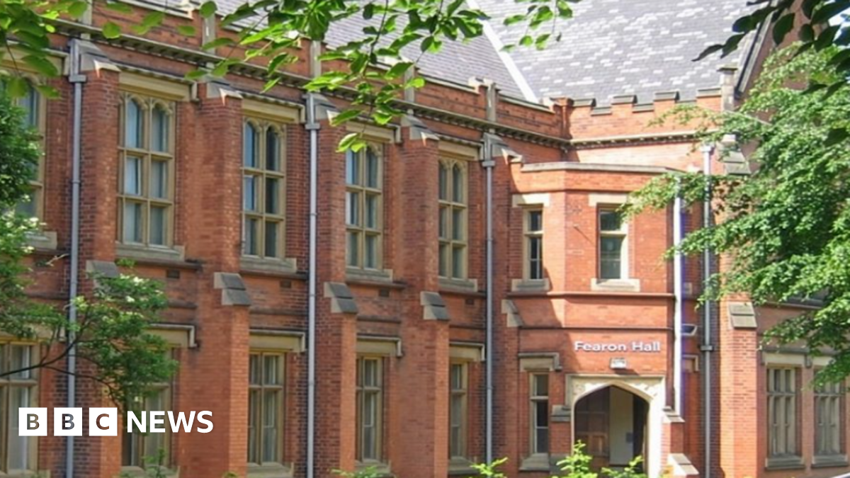 The exterior of Fearon Hall, a red-brick two-storey building with large stone framed windows.