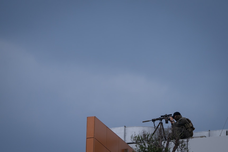 Sniper on a roof at Bondi Beach