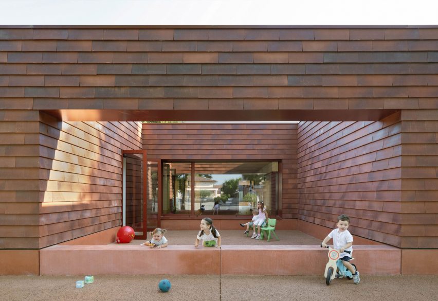 Children playing in courtyard of Kinder Rain in Italy