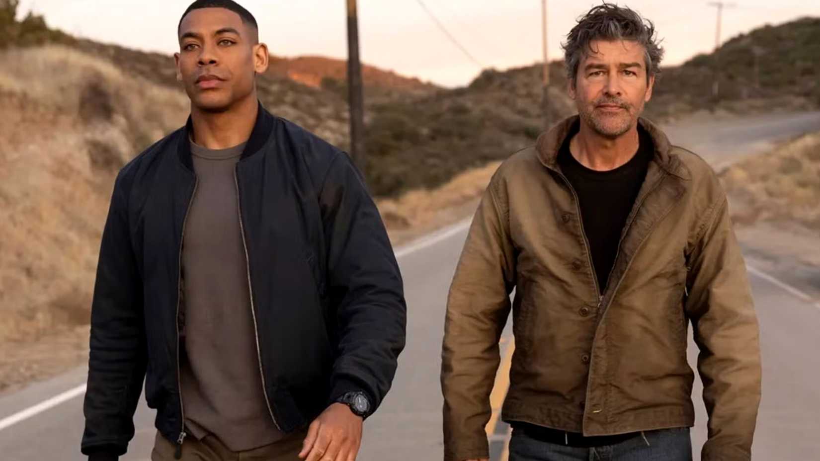 Aaron Pierre's John Stewart and Kyle Chandler's Hal Jordan walk down a road in Lanterns series