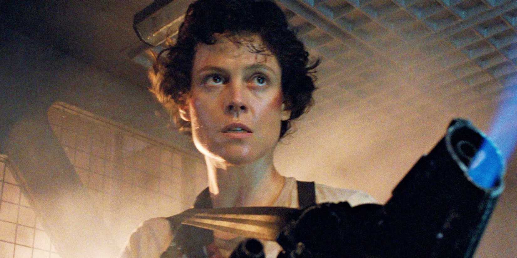 Sigourney Weaver as Ellen Ripley in Aliens (1986), moving down a corridor with a flamethrower.