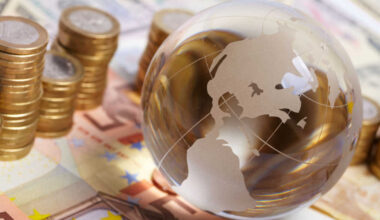 A glass globe and euro notes.