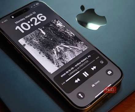 An iPhone 16 Pro set on a MacBook Air