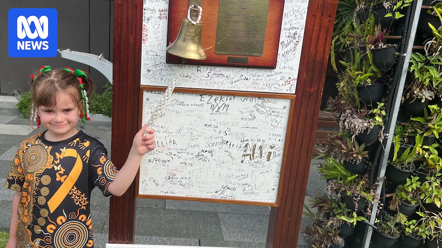 Given the all clear from cancer, 6yo Laylah celebrates by ringing the bell at the Queensland Children's Hospital