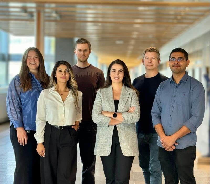 A group of people standing together

AI-generated content may be incorrect.