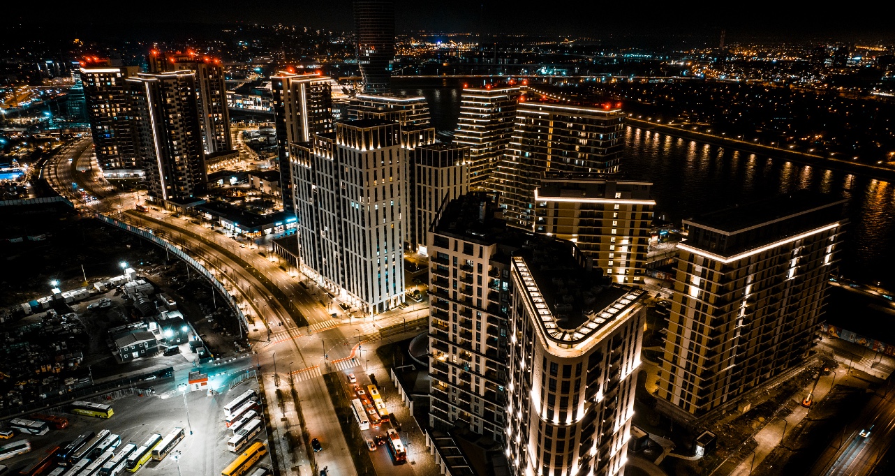 Impressive scenery with tall buildings of the new part of Belgrade captured during the night with a drone.