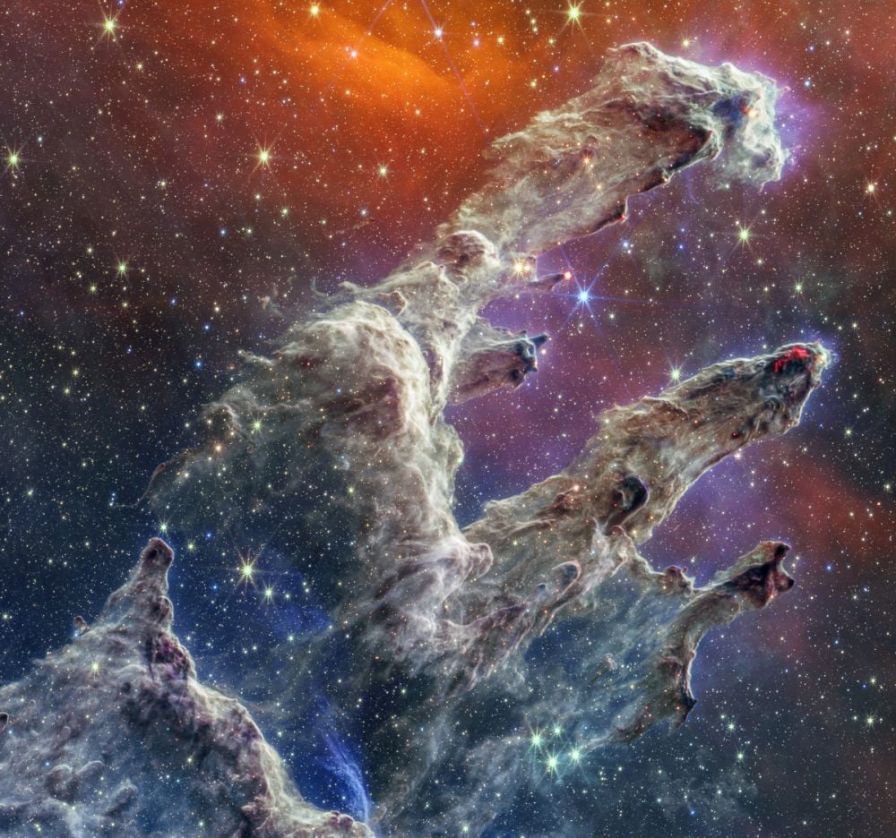 This is the famous Pillars of Creation in the Eagle Nebula, as imaged by the JWST. It's a dramatic view of thousands of young stars forming in the cold gas that makes up the Pillars. They're not visible, but each star is surrounded by a protoplanetary disk in which planets are forming. New research shows that young stars experience growth spurts in their later stages, rapidly accreting material from these disks. Counterintuitively, that aids the formation of gas giants like Jupiter. Image Credit: NASA, ESA, CSA, STScI; Image Processing: Joseph DePasquale (STScI), Alyssa Pagan (STScI), Anton Koekemoer (STScI)