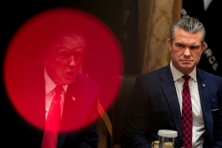 US Defense Secretary Pete Hegseth (R) looks on as President Donald Trump speaks during a cabinet meeting on December 02, 2025. (Photo: AFP)