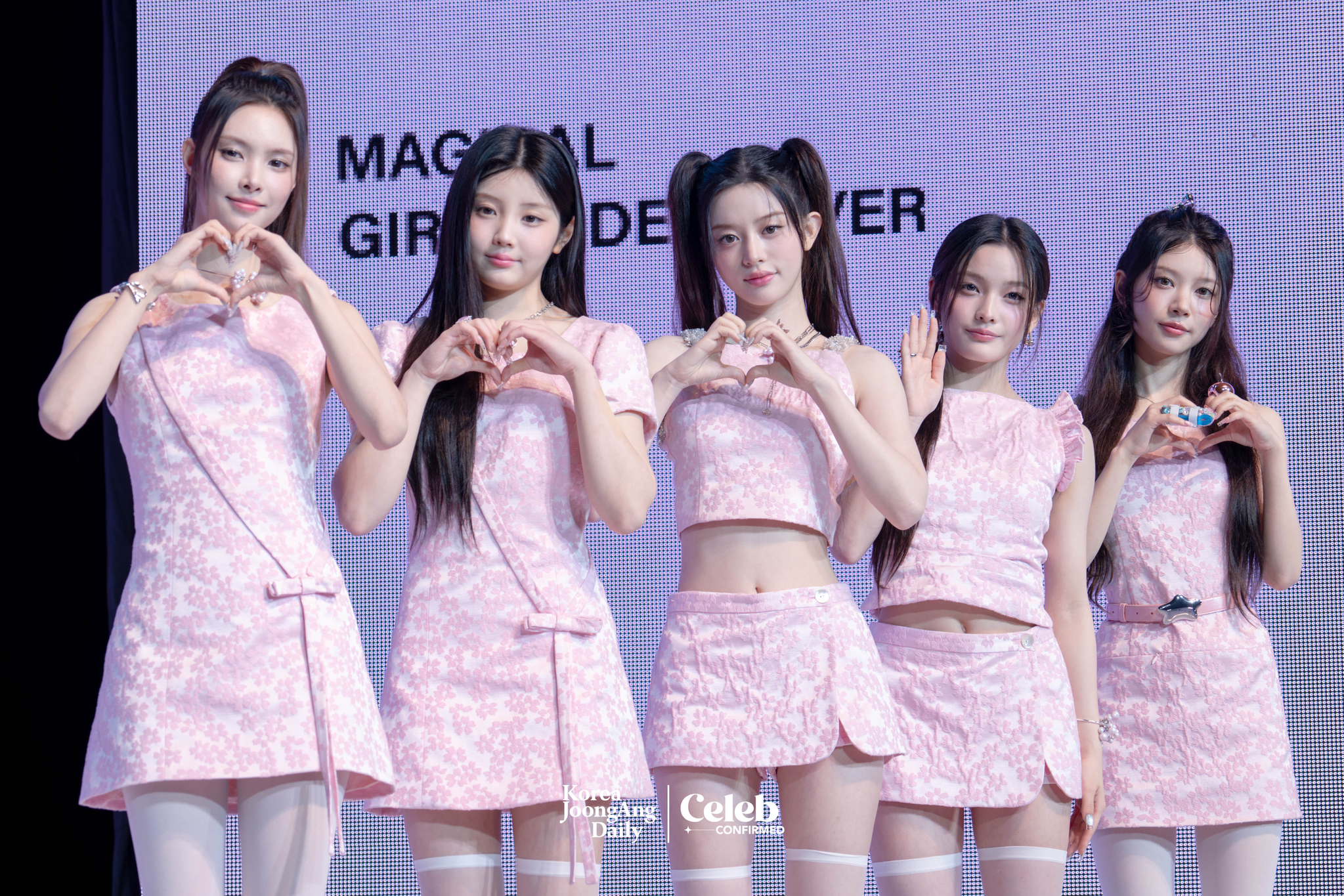 Girl group ILLIT poses for photos during a showcase for the release of its 3rd EP, “bomb,” at the Yes24 Live Hall in eastern Seoul on June 16. [DANIELA GONZALEZ PEREZ]