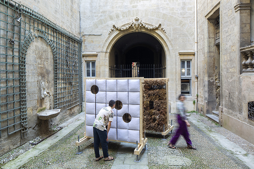 mirroring pillowed walls filled with reed grass compose sensory installation in montpellier