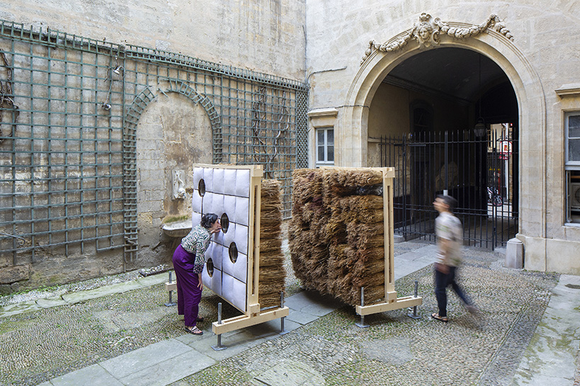 mirroring pillowed walls filled with reed grass compose sensory installation in montpellier