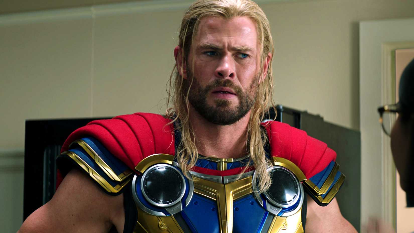 Chris Hemsworth's Thor looking at a doctor in Thor: Love and Thunder