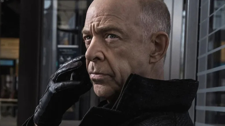 J.K. Simmons' Howard Silk wearing a black glove on Counterpart