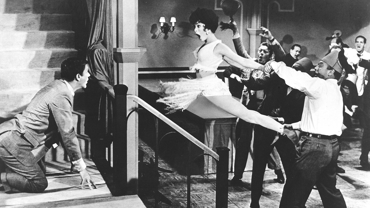 Dick Van Dyke acting out a scene with Janet Leigh in "Bye Bye Birdie."