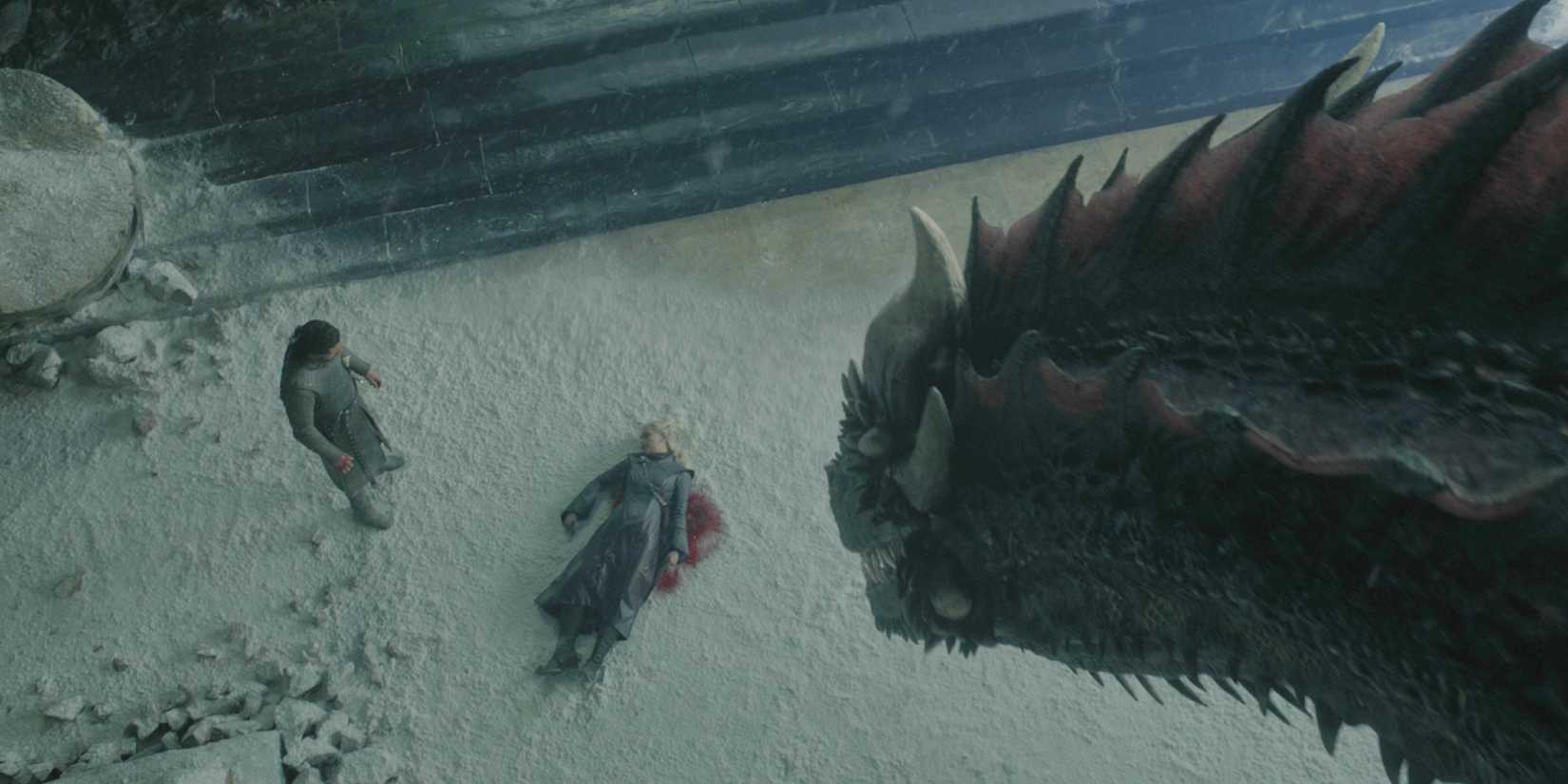 Drogon looking down at Jon Snow with Daenerys' dead body in Game of Thrones' series finale