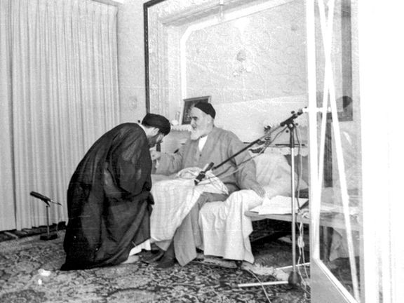 Ali Khamenei kisses the hand of Ruhollah Khomeini, the founder of the Islamic Republic, in an undated image. 