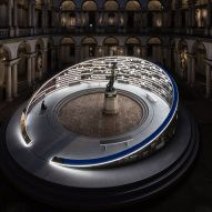 Visitor at Library of Light installation in Milan