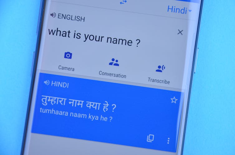 A mobile phone with the Google Translate app open.
