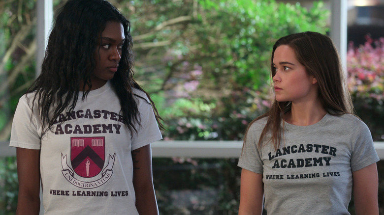 Imani Lewis' Calliope and Sarah Catherine Hook's Juliette looking at each other in First Kill