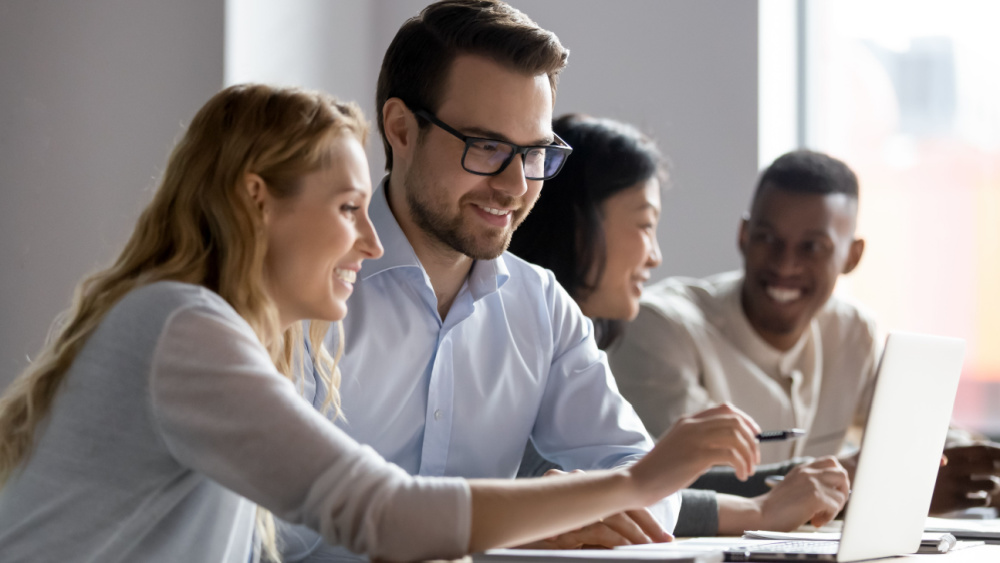 People looking at laptop screens.