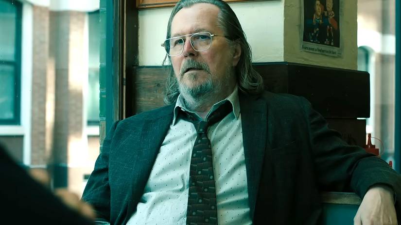 Gary Oldman's Lamb looking upset while sitting in a booth in Slow Horses season 5