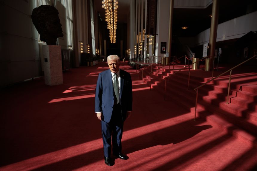 President Donald Trump talks reporters at the Kennedy Center after leading a board meeting on March 17.