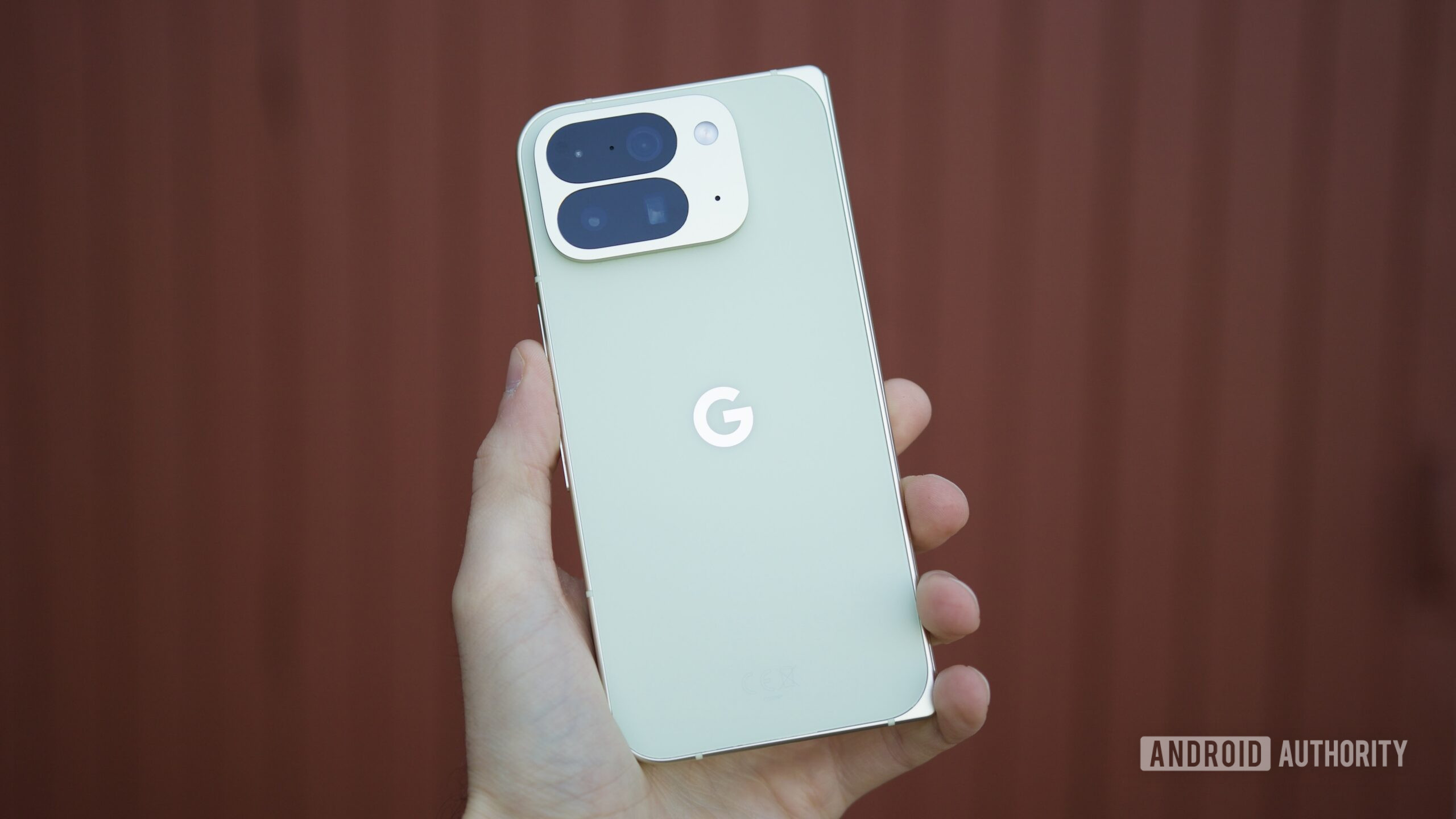 Someone holding the Google Pixel 10 Pro Fold, showing the back of the phone.
