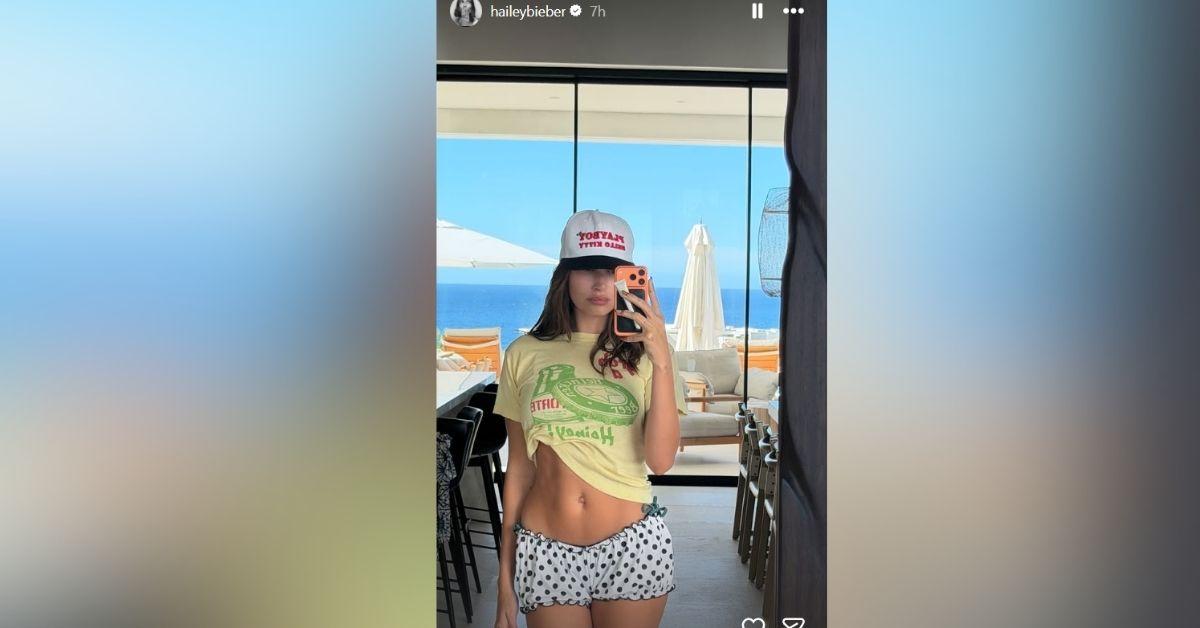image of Hailey Bieber shared a sunny mirror selfie during a warm getaway.