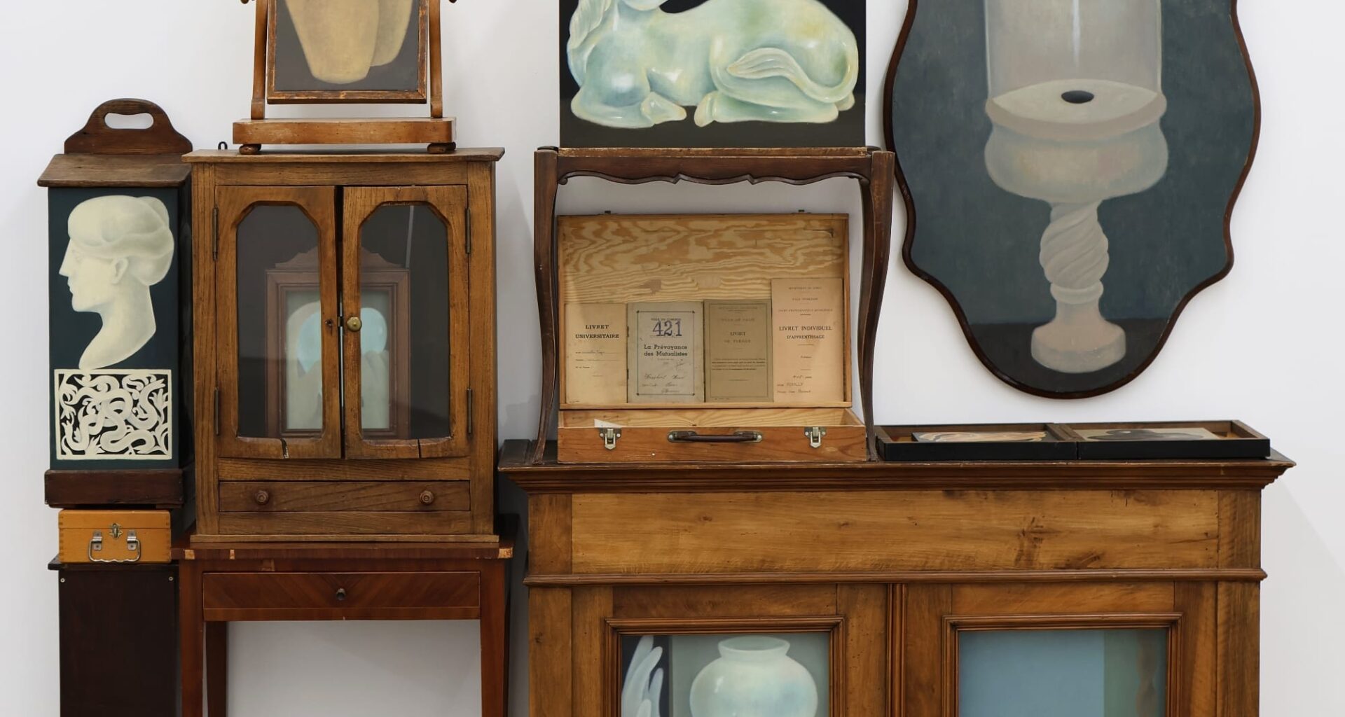 a collection of paintings in wooden furniture by Shuo Hao
