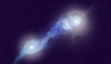 An artist’s impression of a rare trio of merging galaxies, J121/1219+1035, which host three actively feeding, radio-bright supermassive black holes and whose jets light up the surrounding gas. Image credit: NSF / AUI / NRAO / P. Vosteen.