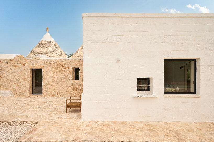 three traditional stone-domed trulli fuse with contemporary residence by studio8 in italy