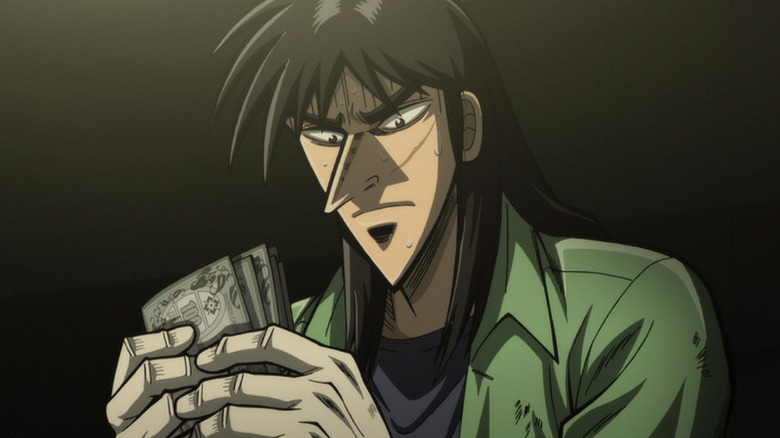 Kaiji Itō nervously holds money on Kaiji
