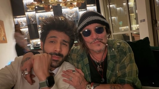 Kartik Aaryan shares a viral photo with Johnny Depp at the Red Sea International Film Festival, igniting hopes for a future collaboration. 