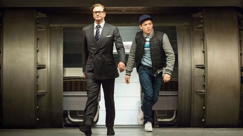 Harry Hart (Colin Firth) and Eggsy Unwin (Taron Egerton) walk into a vault in Kingsman: The Secret Service