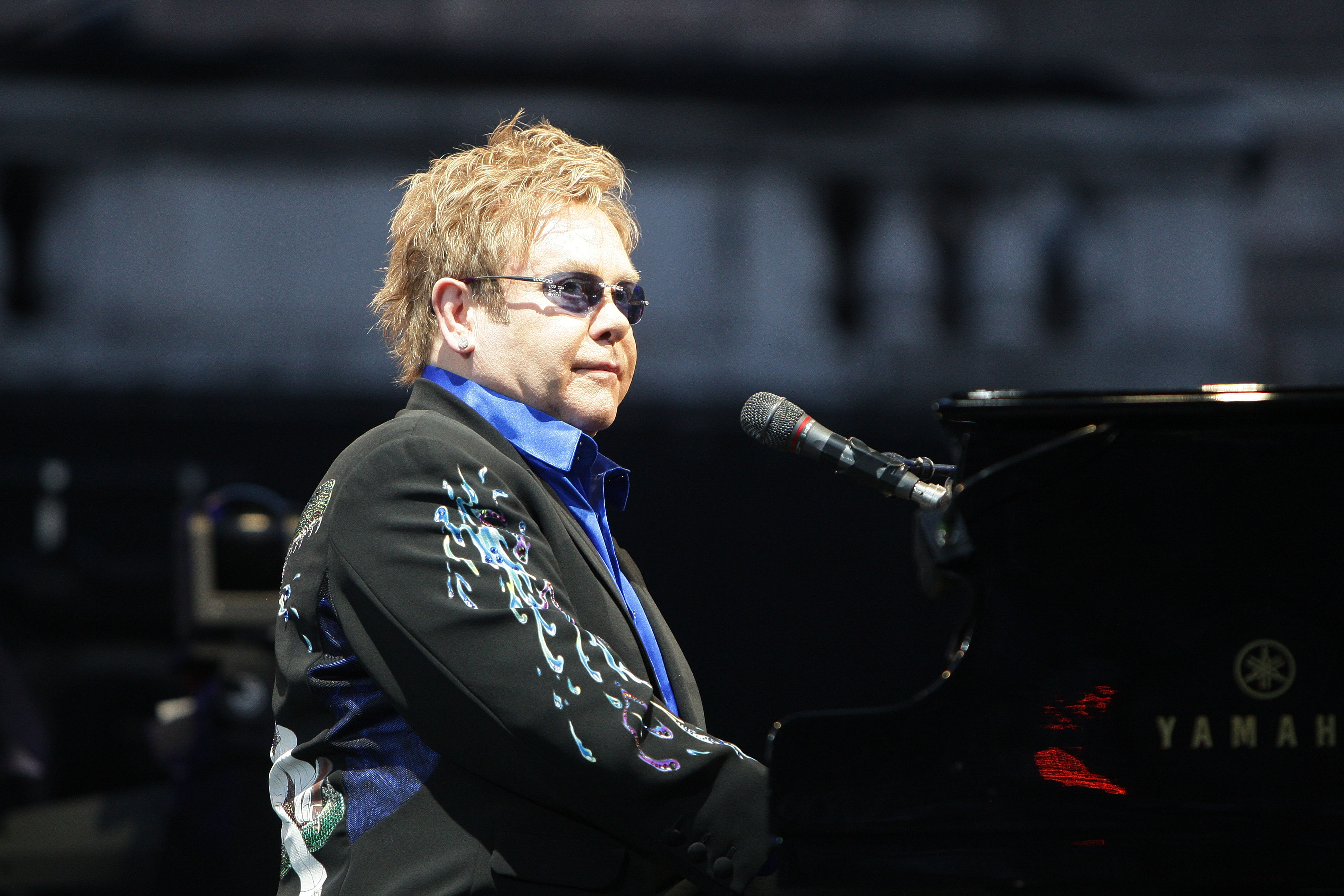 Elton John sat at his piano