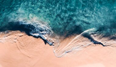 An aerial view of crashing waves shot at a vertical angle by Kevin Krautgartner