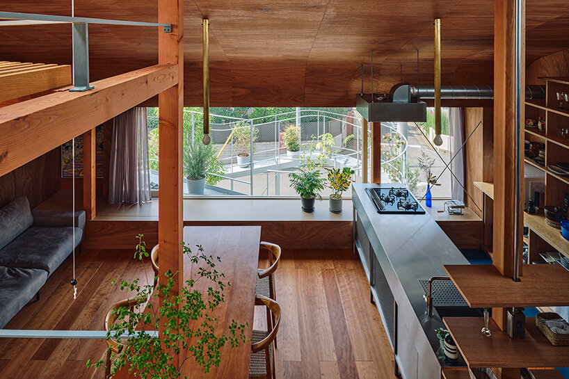 looping terrace arcs toward the street to bring daylight inside a tokyo dwelling by HOAA