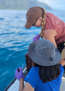 two people sampling water