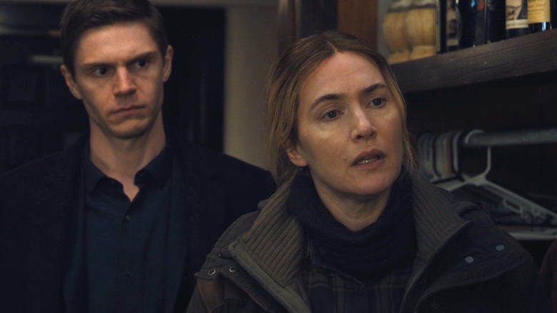 Mare (Kate Winslet) and Colin (Evan Peters) working on a case on Mare of Easttown