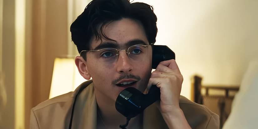 Timothée Chalamet on the phone in Marty Supreme.