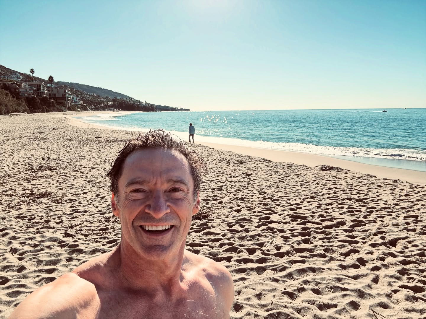 Hugh Jackman takes a break from promoting his new movie, “Song Sung Blue,” to catch some waves.