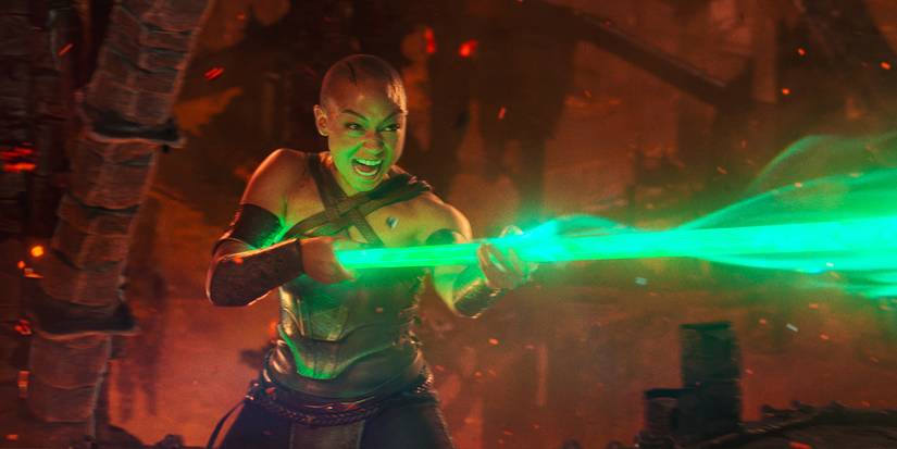 Jade screaming and using her powers with her glowing green staff.