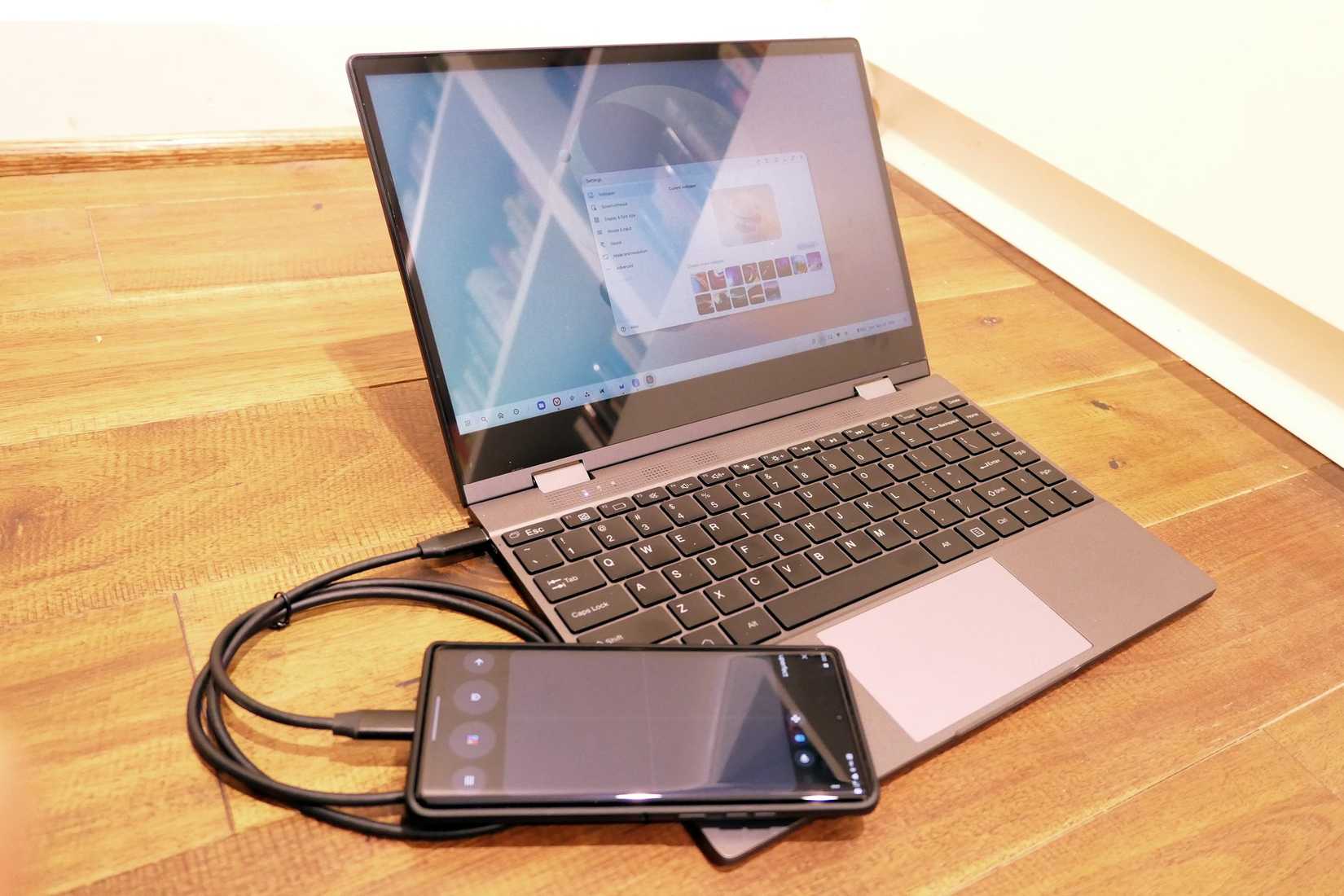 A Motorola Edge+ plugged into a lapdock.