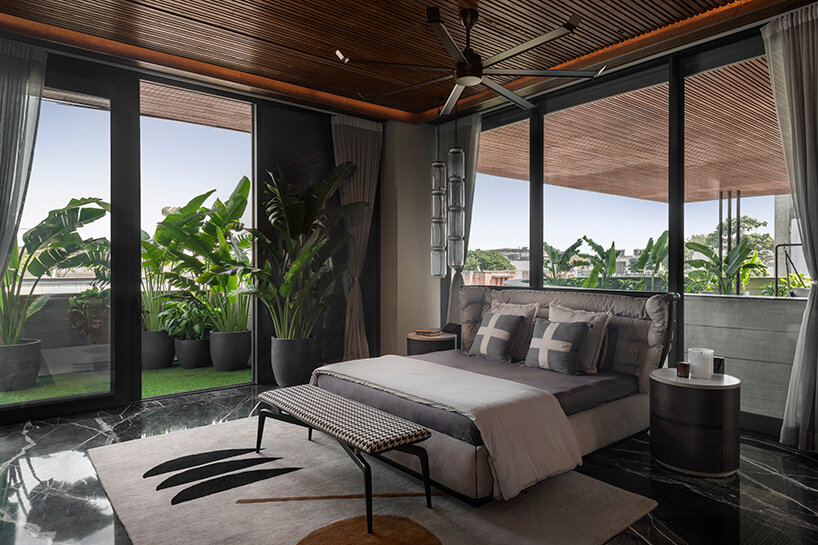 atrey and associates' brutalist home pairs climatic intelligence with material honesty