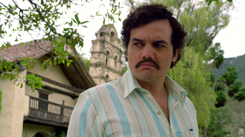 Pablo Escobar (Wagner Moura) grimly considers in Narcos