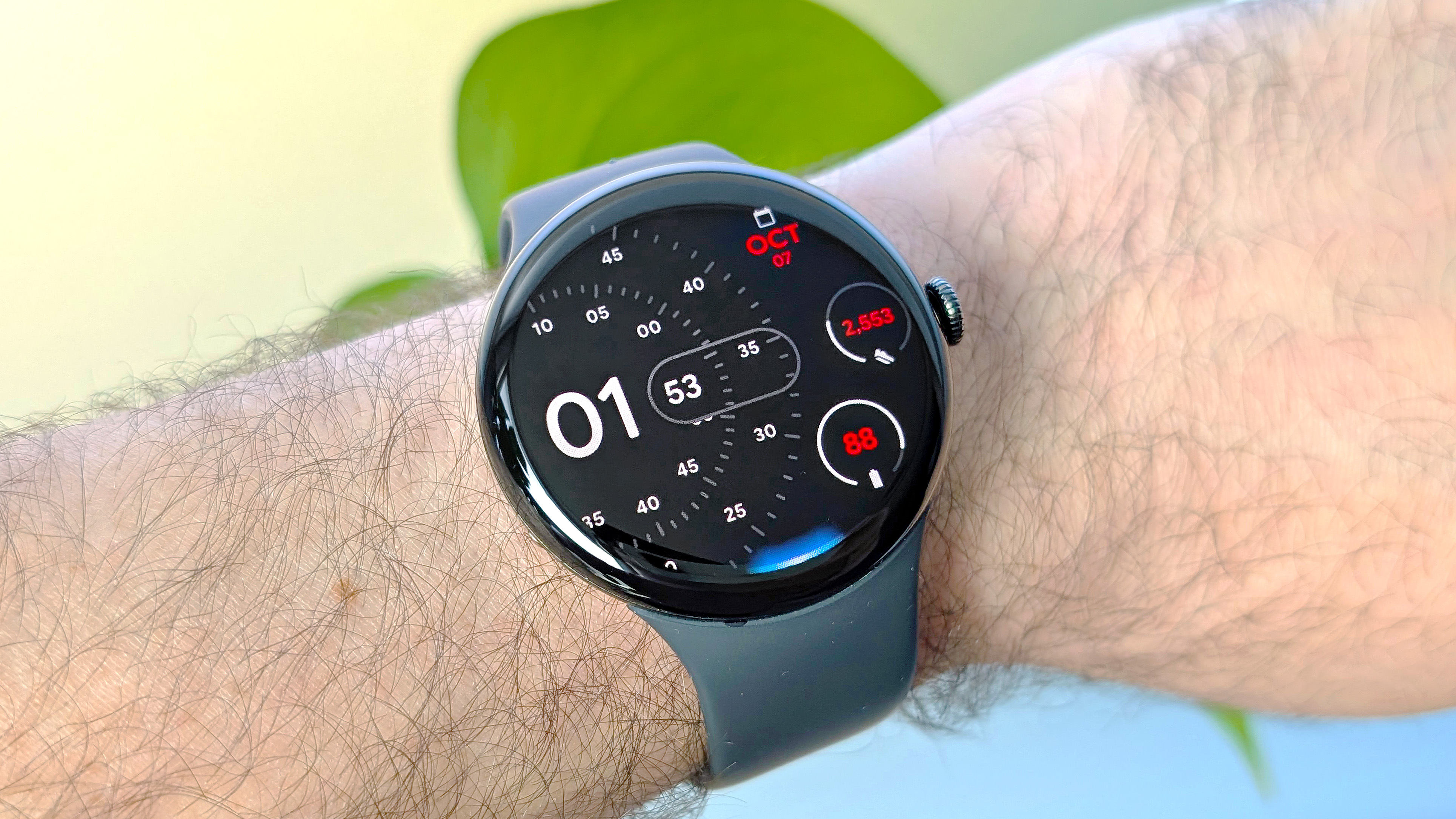 Close-up of the Google Pixel Watch 4 in 45mm on a user's wrist with Gemini AI active