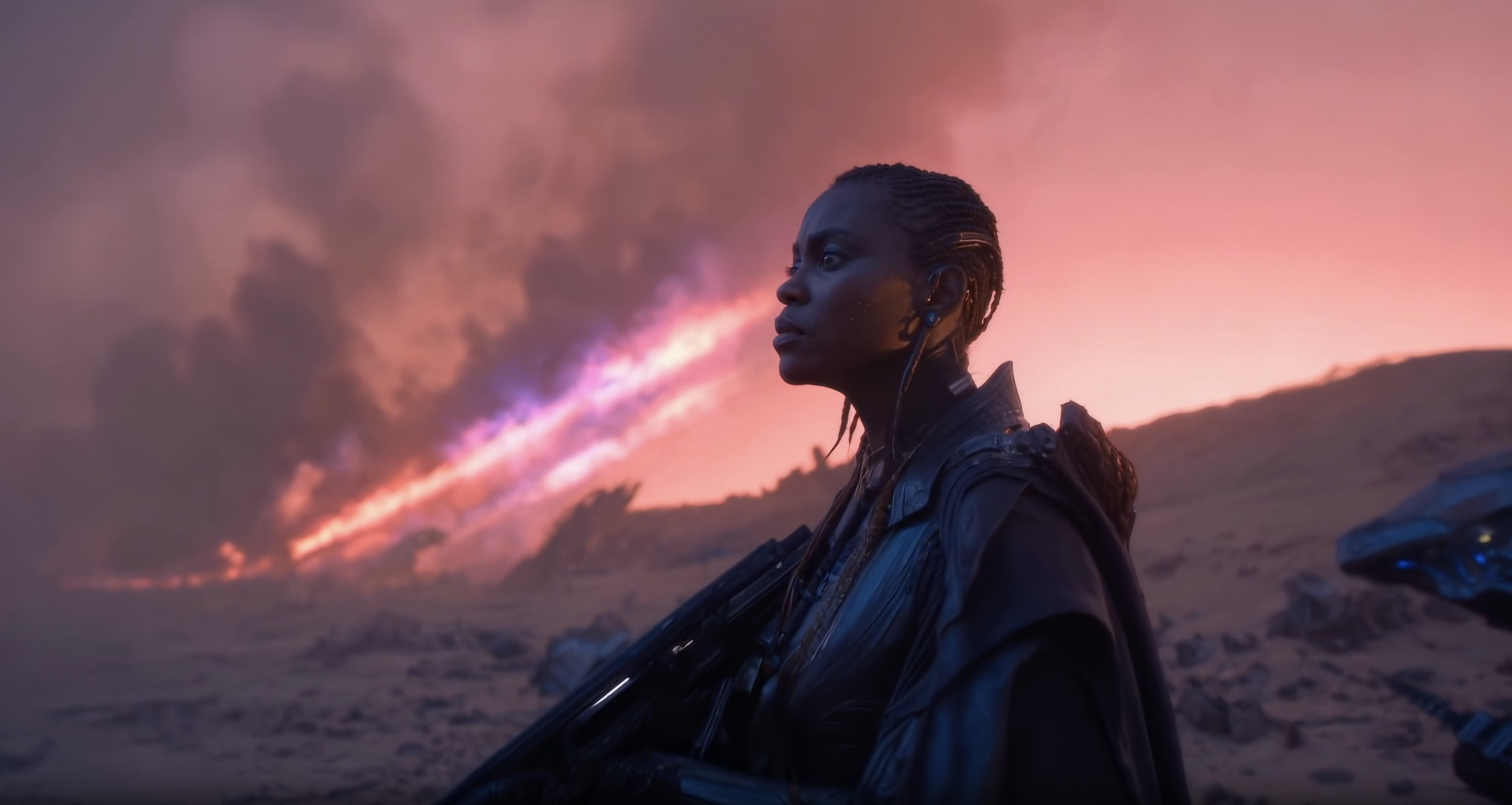 A woman in dark futuristic clothing stands in a barren landscape, looking toward an ominous red and purple blast of light and smoke on the horizon, holding a rifle.