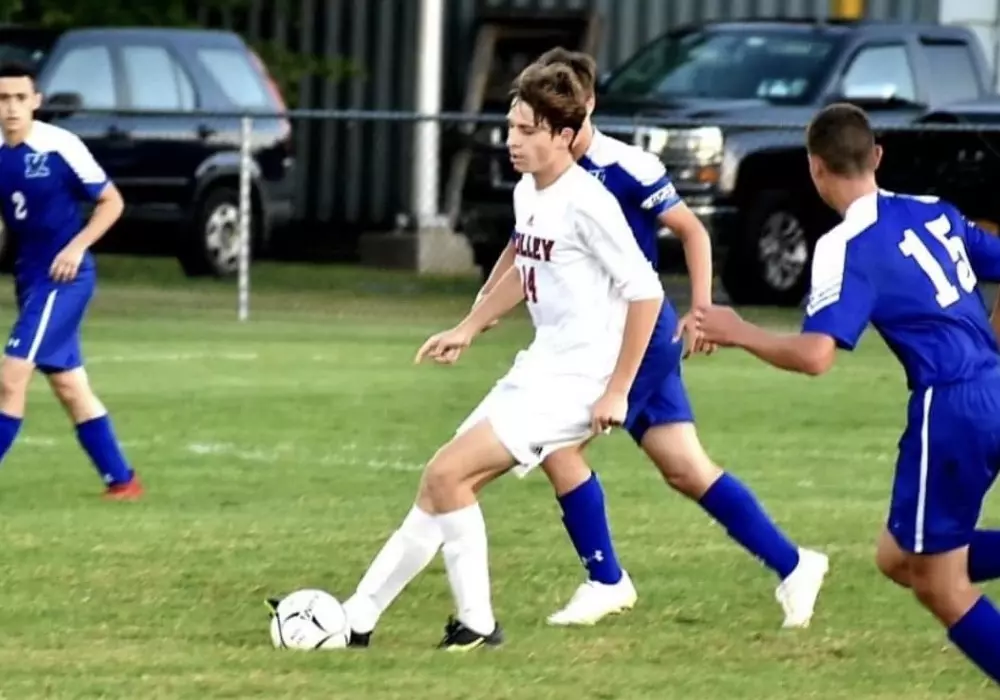 Broek Ostrom playing soccer in high school