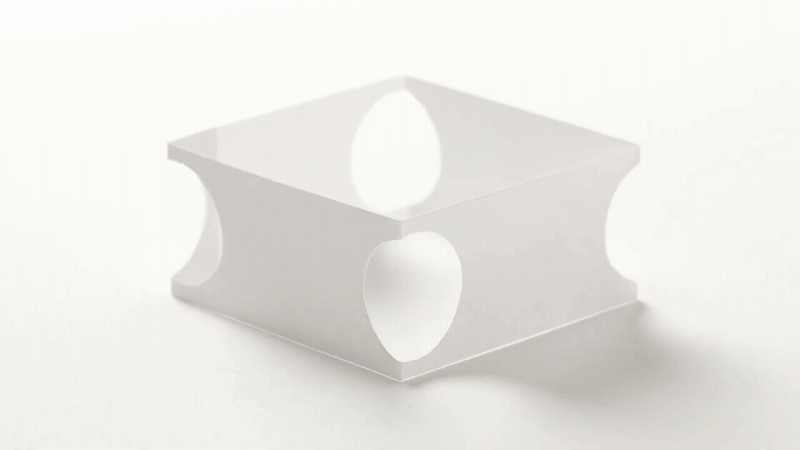 An animated gif of a square piece of paper with circular holes that appear to be moving around on their own